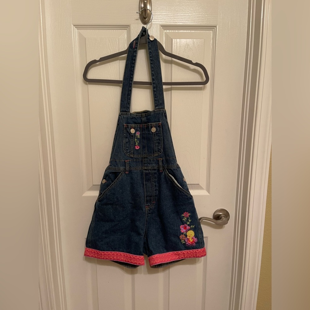 Looney Tunes adjustable halter top overalls with an elastic waste band.